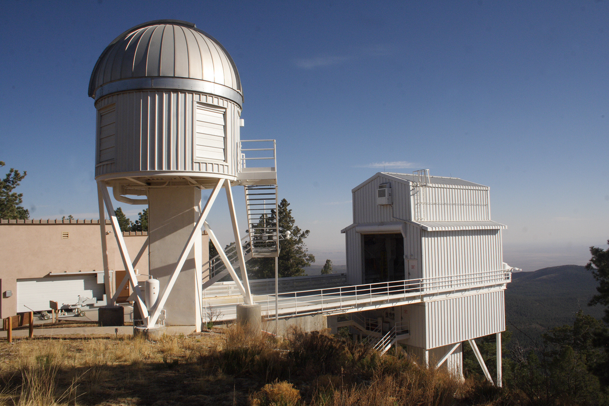 The NMSU 1-meter telescope structure at APO, with the Sloan Telescope housing in the background. <i>Image Credit: Maurice Clark</i>