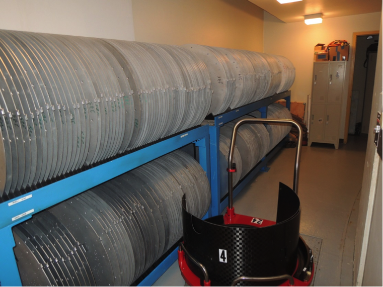 Plate storage racks at the du Pont Telescope. To the right of the racks is an empty cart. <em>Photo courtesy of J. Wilson.</em>