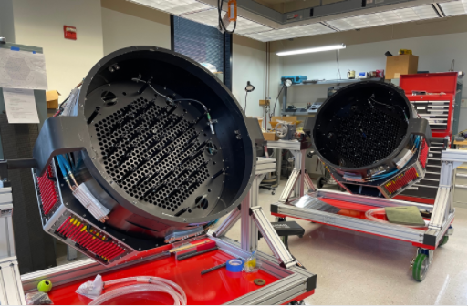Robotic fiber positioners sit on rigs ready to be loaded onto telescopes