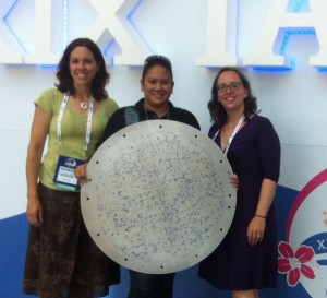 Three people, including Karen Masters, pose with an SDSS plate