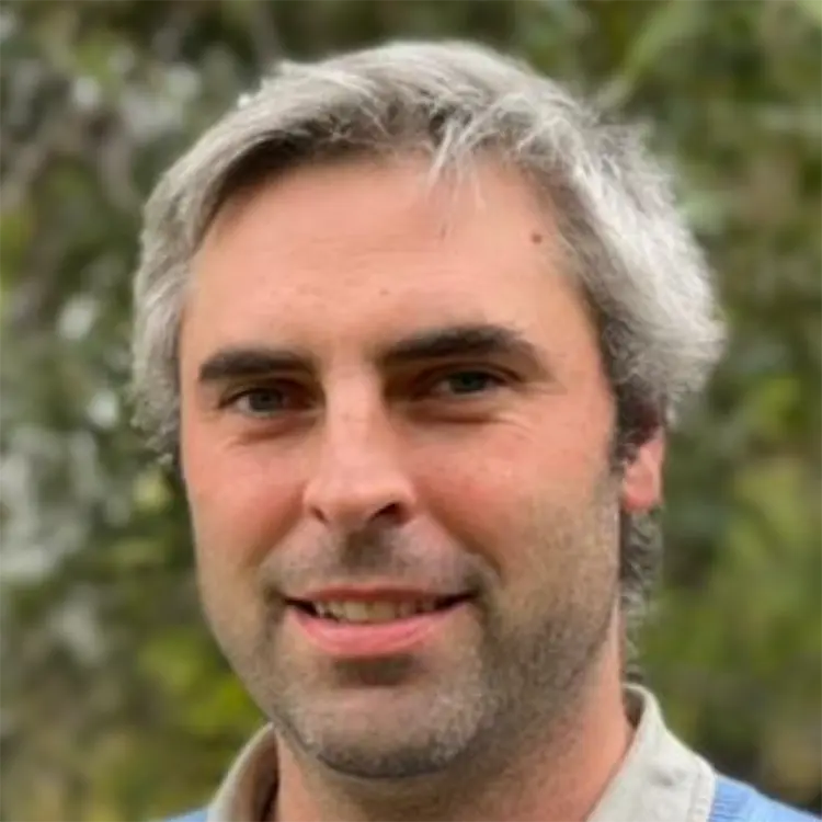 Guillermo Blanc posing in front of a forest